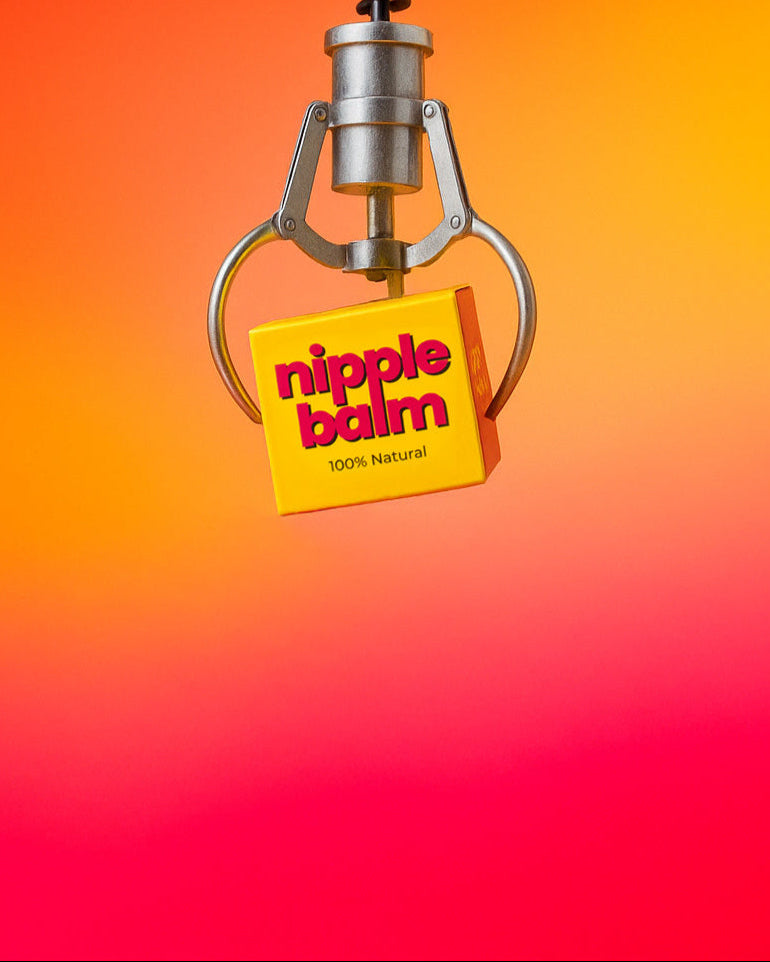 Nipple balm with a yellow square label on an orange and red gradient background